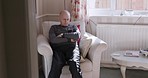 Senior, health care and nursing home patient with dementia, parkinson or alzheimer in healthcare. Thinking, rest and relax of retirement and elderly man after surgery or rehabilitation in a house