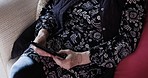 Communication on sofa and senior woman with phone in apartment or nursing home. Social media, networking and relax on couch connected on smartphone, grandma reading news or email on internet website.