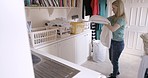 Woman, clean laundry and fold clothes in modern home for household clothing chore routine, domestic work and cleaning garments. Fresh linen, spring clean material and organize sheets, duvet and towel