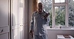 Fitness, dumbbell and strong with a senior man in his retirement home, exercising for health or wellness. Exercise, gym equipment and workout with an elderly male pensioner training in his house
