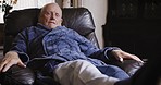 Rehabilitation, rest and senior man on sofa laying to relax, recover and stretch legs after knee surgery. Healthcare, retirement and elderly male resting after physical therapy and healing at home