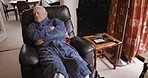 Sleep, rest and senior man on a sofa with a warm gown to take a nap in the living room of his house. Relax, insomnia and elderly guy in retirement sleeping or resting on a couch in the lounge at home