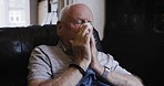 Senior man, cleaning nose and sick tissue, tired and suffering from flu virus, cold or covid in home. Elderly male with a bad allergy or coronavirus sneezing with a sinus, cough or allergies on sofa
