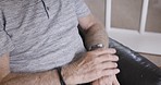 Time, watch and senior man with stress, anxiety and frustrated in the living room of a house. Waiting, impatient and elderly man reading on a smart watch while in retirement at a nursing home