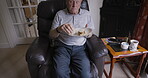 Senior man, eating sandwich and relax on sofa in living room in nursing home, healthy food or lunch for nutrition. Elderly person, hungry and eat meal on couch for health diet in retirement home