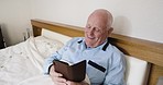 Senior man, bed and relax with phone, reading online or social media with pajamas, smile and room. Elderly gentleman, bedroom and smartphone communication on social network, email and happy in home