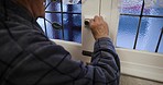 Senior man, lock door and safety for protection, security and privacy in home, apartment and retirement life in England. Fear, homeowner and susiciecios elderly man, chain and entrance in house