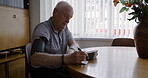 Blood pressure, senior man and writing notes for healthcare, medical test or monitor cholesterol, check hypertension or cardiovascular data at home. Old man, pulse and record results of diabetes risk