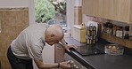 Dishwasher, senior cleaning and kitchen work of a man in a retirement nursing home cooking. Elderly person in a house tidy room to start making food or tidy household after eating by washing dishes