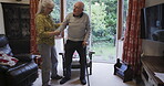 Walking stick, disability and senior couple in retirement home with support, hand holding and happy together. Elderly people or disabled partner with woman helping in living room, cane and Parkinson