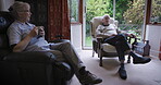 Elderly, couple in retirement relax with conversation together and coffee break at house or nursing home. People, care and love in marriage with communication, health with wellness and retired