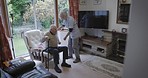 Living room, nurse help senior man in chair for healthcare, disability assistance and medical support. Nursing home, retirement and caregiver helping elderly patient relax, rest and sitting on couch