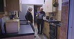 Talking, love and senior couple relax in a kitchen, happy and smile while bonding in their home. Elderly, woman and man speaking, laughing and enjoying retirement, morning and relationship indoors