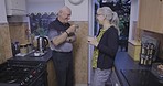 Morning, coffee and senior couple talking about retirement, joke and funny story in the kitchen. Peace, smile and elderly man and woman with tea drink, conversation and laughing during communication
