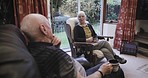 Senior couple, living room conversation and laugh in a nursing home together with love. Marriage retirement and old man and woman sitting in a lounge with elderly communication and happiness