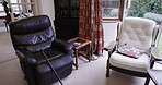 Home, help or walking stick in empty aid house, nursing living room or space with relax armchairs or furniture. Retirement mobility, disability or cane healthcare in residential property or hospice