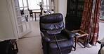 Healthcare, help and walking stick in empty aid house, nursing home or living room with relax armchairs or sofa furniture. Retirement mobility, disability or medical cane in wellness hospice property