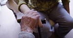 Holding hands, support and senior couple in home with affection, empathy and bonding, trust and care. Love, cane and elderly retired man and woman together in house for unity, respect and compassion.