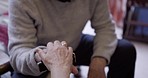 Couple, holding hands and support for man with disability, empathy and kindness in their home. Love, trust and hand of elderly woman on disabled man for encouragement, comforting or stroke recovery 