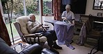 Relax, conversation and senior couple ironing, talking and in communication during housework. Laundry, company and elderly man speaking to a woman doing chores, housekeeping and housewife work