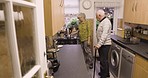 Kitchen, retirement and senior couple with coffee enjoy quality time together talking, chatting and conversation. Nursing home, relax and old man and woman prepare tea, beverage and drink in morning