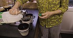 Kitchen, coffee and woman pouring milk in cup at breakfast time in home, grandma making beverage for grandpa. Morning, tea and senior couple enjoying retirement, hot drink and marriage with love.