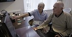 Computer, nursing home and nurse with senior man at desk learning online technology, email and internet. Retirement support, communication and caregiver helping talking and teaching elderly patient