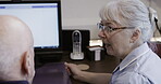 Caregiver, help and senior man learning technology or talking to therapist, nurse or woman for therapy. Elderly, pensioner and retirement home or nursing house with old male in a discussion