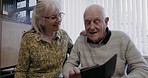 Retirement, senior couple and smartphone for connection, love and typing in living room, communication and social media. Romance, old woman and elderly man with cellphone, bonding and loving together
