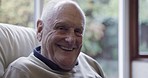 Elderly man, portrait and laughing of an senior person in a retirement home sofa with happiness. Happy, old person face and relax male on living room couch in a lounge smiling with joy alone in house