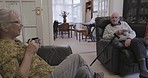 Conversation, coffee and senior couple in retirement to relax with communication and love. Together, talking and an elderly man and woman speaking while drinking tea for morning company in the lounge