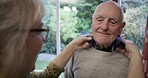 Care, help and woman with a man for dressing, love and morning routine process in a home. Retirement, conversation and senior couple helping with tidying clothing, dress up and assistance with shirt
