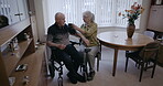Blood pressure, retirement couple and home for medical test of cholesterol, hypertension or cardiology. Senior woman check arm pulse of disabled man for heart health, diabetes and cardiovascular care