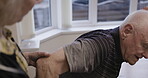 Physiotherapy, support and senior couple in home helping man to get up in house. Physical therapy, retirement rehabilitation and elderly woman or caregiver assisting male with standing with old age.