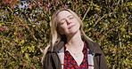 Happy woman, travel and smile in relax for nature, fresh air or sunshine for vitamin D in countryside. Female traveler smiling in joyful relaxation happiness for calm, freedom or natural environment