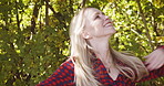 Freedom, peace and nature with woman in countryside park for earth, relax and summer break. Garden, environment and happy with girl enjoying outdoors for carefree, smile and breathing fresh air