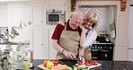 Happiness, old couple in kitchen cooking brunch and love in retirement with healthy food and vegetable diet. Happy woman, senior man in apron and conversation during meal prep, bonding in apartment.