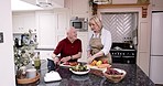 Cooking, tablet and old couple in kitchen with online recipe, healthy food and vegetable diet in retirement. Happy woman, senior man and internet search for meal prep advice, marriage bonding in home