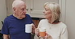 Coffee, morning and an elderly couple in the kitchen of a retirement home, chatting or bonding together. Love, drink or beverage with a senior man and woman enjoying caffeine while talking in a house