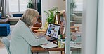 Senior woman, laptop and digital marketing in remote work and writing, strategy or ideas at home office. Elderly female person or creative designer on computer taking notes in book for web research