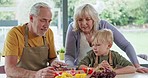 Cooking, grandparents and child with breakfast food in the kitchen of a house. Elderly man and woman preparing a healthy meal with their grandson at home