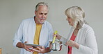 Cooking, senior couple and breakfast food in the kitchen of a house using a tablet online. Elderly man and woman preparing a lunch on the stove at home
