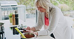 Cooking, recipe and senior woman with phone for online breakfast food in the kitchen of a house. Elderly person reading on the internet for healthy lunch