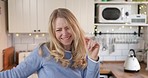 Happy woman in kitchen, dancing and excited in home with fun, freedom and music in Canada. Happiness, new house and dance to celebrate smile and wellness with positive mindset for time alone for girl