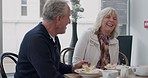 Breakfast, cafe and happy senior couple eating together for bonding, quality time and conversation. Restaurant, marriage and man and woman with food to relax, chat and morning date in coffee shop