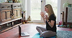 Yoga, laptop and online class with woman in living room for fitness, social media and learning. Workout, meditation and peace with person and video call at home for balance, spiritual and mindfulness