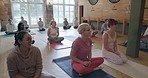 Exercise, yoga and a group of people in a class for health, wellness or awareness of inner peace and balance. Diversity, fitness or pilates training with men and women waiting to start their workout