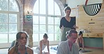 Teaching, yoga and health with woman in class for fitness, meditation and mindfulness. Peace, wellness and learning with people stretching in pilates studio for balance, workout and energy exercise