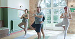 Yoga, help and teacher with people in studio for learning, workout and mindfulness. Balance, meditation and peace with instructor in pilates class for coaching, energy and spiritual wellness