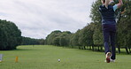 Woman, golf course and golfing with club, swinging and stroke for ball, fitness and exercise. Countryside, grass and game for training, outdoor and recreation for hobby, playing and sport technique